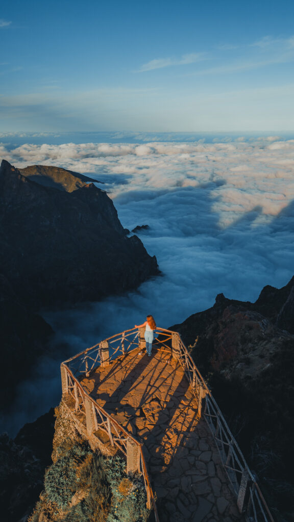 Girl standing above the clouds at Pico do Ariero - 7-day Madeira itinerary